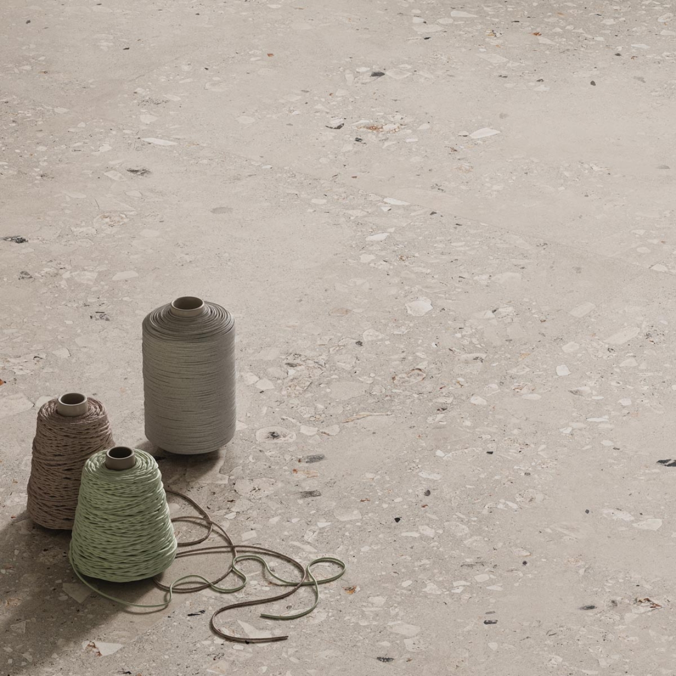 Fliese Sant Agostino Logico in der Farbe Pearl verlegt unter drei Fadenrollen