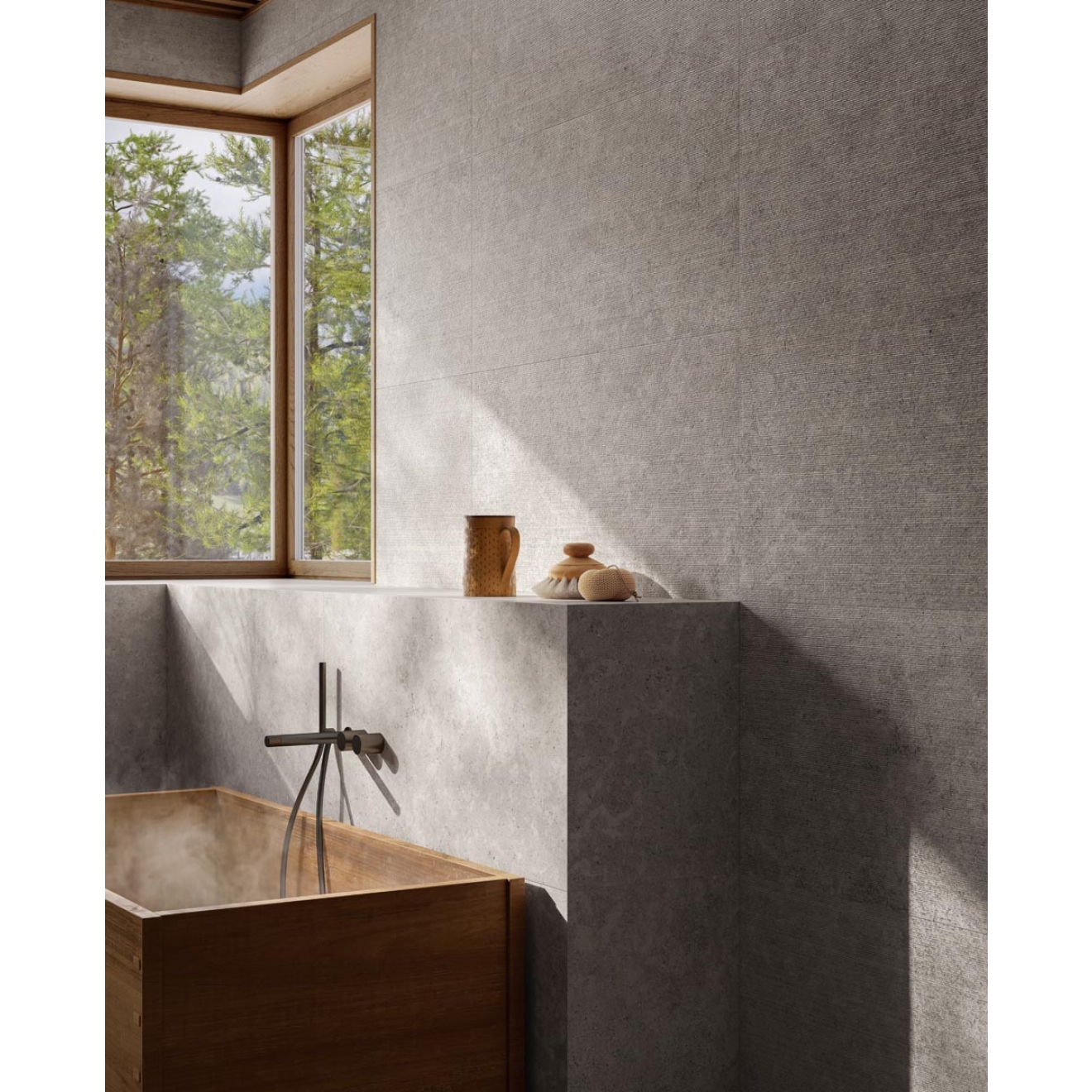 Fliese Sant Agostino Unionstone 2 in der Farbe Cedre Grey verlegt hinter einer Badewanne