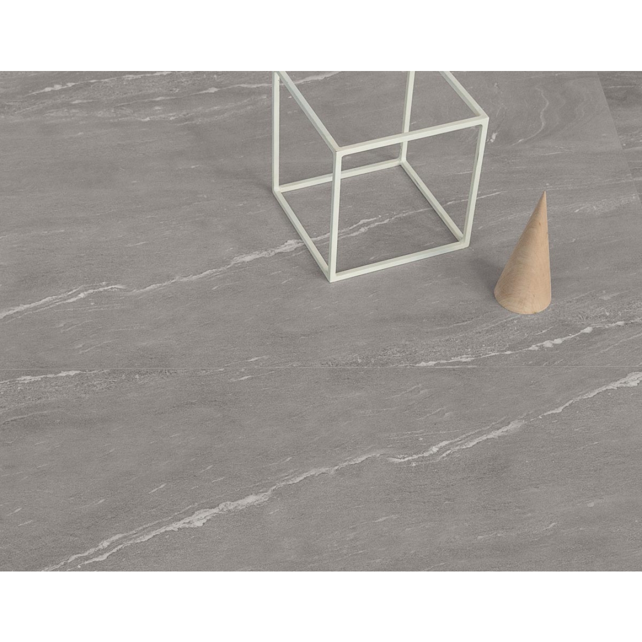 Fliese Sant Agostino Waystone in der Farbe Grey verlegt unter einem Würfel