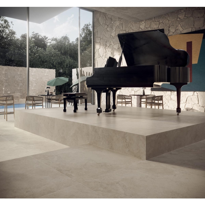 Terrassenplatte Blustyle Solaris in der Farbe Spalato verlegt unter einem Klavier