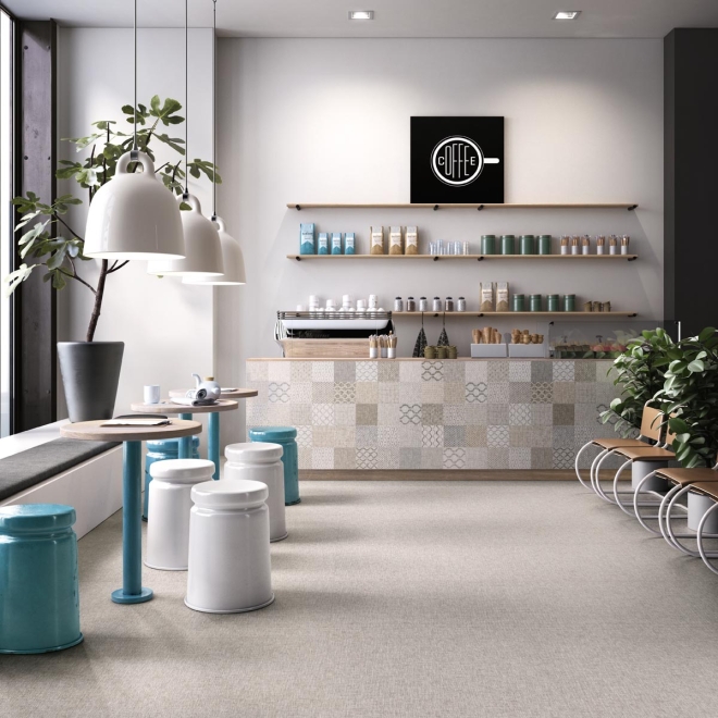 Fliese Sant Agostino Fineart in der Farbe Pearl verlegt in einem Café