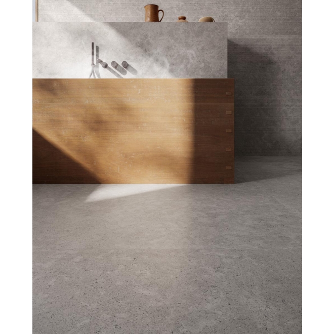 Fliese Sant Agostino Unionstone 2 in der Farbe Cedre Grey verlegt unter einer Badewanne