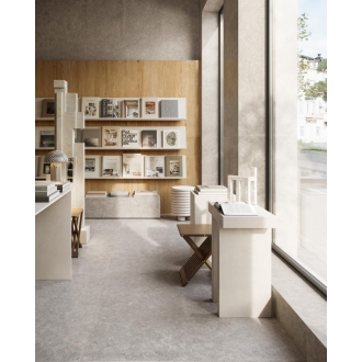 Fliese Sant Agostino Unionstone 2 in der Farbe Cedre Grey verlegt in einem Buchladen
